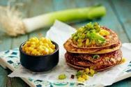 Hearty pancakes with corn, onion, egg and herbs